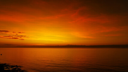 Stunning sunset over calm ocean waters