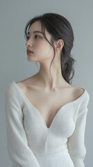 Obraz premium Ethereal Grace: A captivating portrait of a beautiful woman, emanating serenity and delicate beauty. Captured in a studio setting, she embodies understated elegance and natural charm.