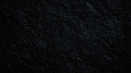 Fototapeta premium Textured black paper with deep creases and folds creates dramatic backdrop