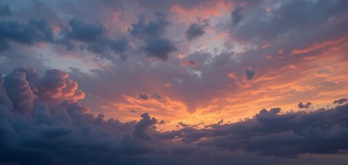 Naklejka premium Artistic sunset sky scene, bold orange and blush-pink clouds stretching across a cool blue-gray horizon, dynamic composition, dreamy lighting, dramatic dusk