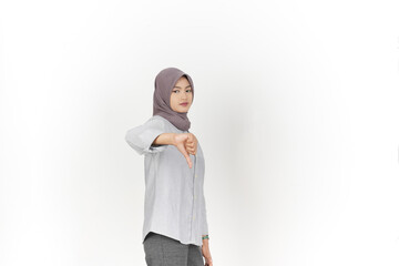Showing thumbs down, disagree sign Of Beautiful Asian Woman Wearing Hijab Isolated On White...