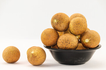 Several Longans in Cluster Beside Peeled Ones