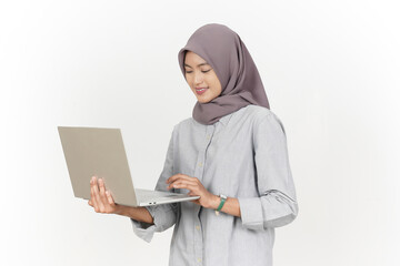 Holding and Using Laptop Of Beautiful Asian Woman Wearing Hijab Isolated On White Background