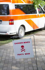 Sign Danger Mines and a translation into Ukrainian. Kyiv, Ukraine, April 28, 2017
