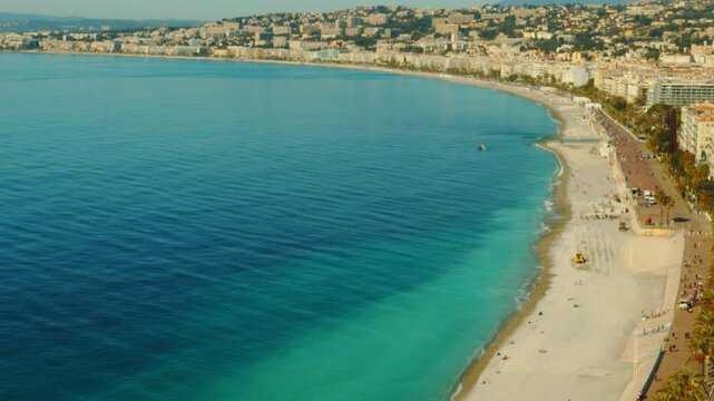 4K French Riviera Nice view of a beautiful beach from the Colline du Ch&acirc;teau with pan towards the Baie des Anges and the entire coastline