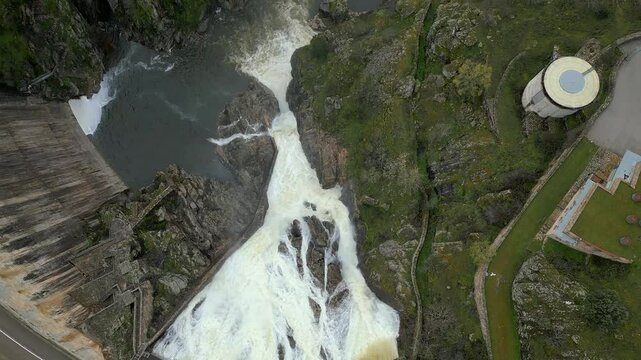Dam of the Atazar reservoir in Madrid, overflowing with water due to the large amount fallen by the rains.