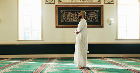 Islamic man, mosque and prayer for faith, worship Allah or holy religion on Eid Mubarak. Temple,...