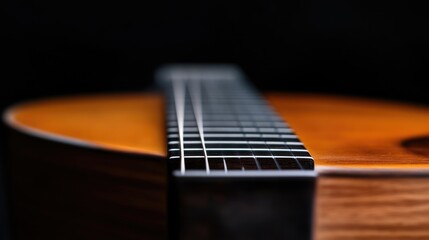 Fototapeta premium Close-up of acoustic guitar fretboard. Wooden guitar neck and fretboard detail
