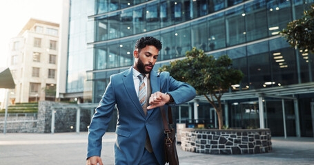 City, walking and businessman check watch for morning commute, travel and work schedule. Corporate, professional and person with rush or hurry for time management, meeting and appointment in town