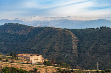 Naklejka premium Green hills and snowy mountains Sierra Nevada in Andalusia, Spain.