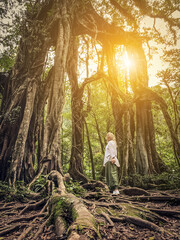 Woman near Giant Fig Tree in Bali Botanic Garden