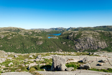 Scenic Mountain Landscape with Rocky Terrain and Green Forests From Preikestolen Hiking Trail, Stavanger, Norway, July 2018