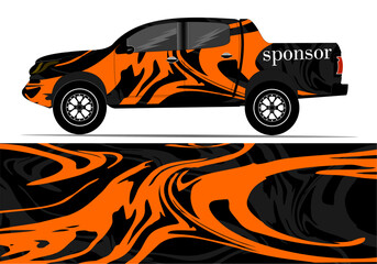 Vibrant orange and black patterned truck showcasing dynamic design, parked against a simple backdrop