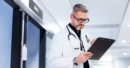 Doctor, healthcare and man with clipboard at hospital for patient health report, medical research...