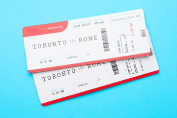 Travel agency. Flight tickets on light blue background, top view