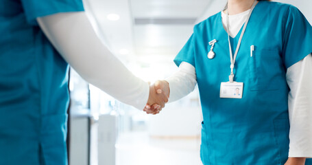 Handshake, medical and welcome with nurses in hospital for agreement, deal or partnership closeup....