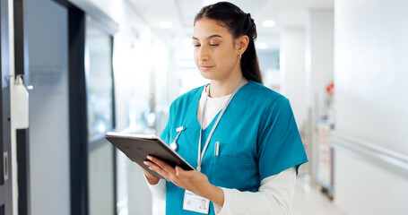 Reading, woman and nurse with tablet in healthcare, patient information and medical research. Hospital, female person and surgeon with tech for diagnosis results, telehealth and report for treatment
