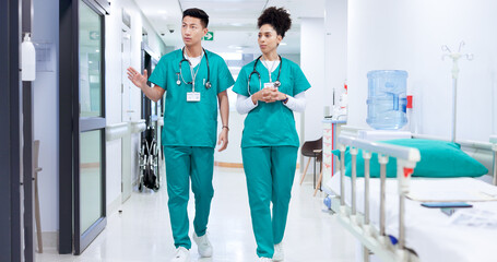 Surgeon, man and woman with discussion in hallway at hospital with healthcare services for...