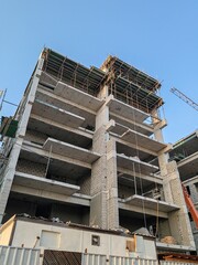 Under construction residential building with Concreate Block bricks structure.
Building Exterior Modern Design Top Level View with Modern Design Structure.
G+6 floor buildings Skyscraper with blue sky