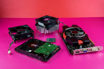 Used Computer Components Arranged on a Coloured Base and Background