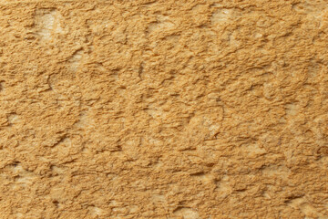 Orange  polyurethane foam harden structure abstract textured backdrop, close up