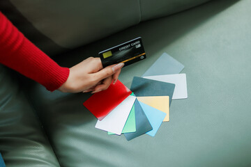 She used her credit card to buy clothes online.