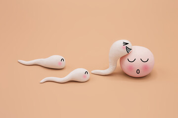 Handmade Polymer Clay Figure of Human Sperm Impregnate a Fertile Human Egg