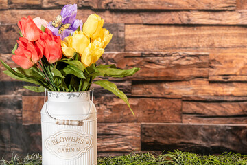 colorful tulip bouquet on dark rustic background with room for copy