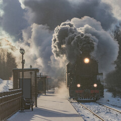Retro train arrives to the platform.