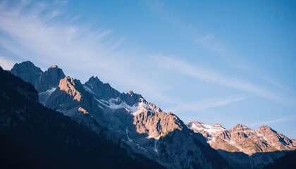 Fototapeta premium Majestic Snowcapped Mountain Range at Sunrise