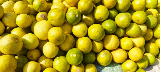 A pile of fresh lemon open sell in Indian market.