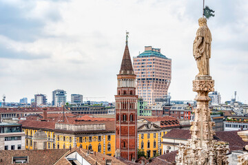 Obraz premium View from top of Duomo di Milano with the Bell tower of the catholic church of San Gottardo in Corte at the Royal Palace