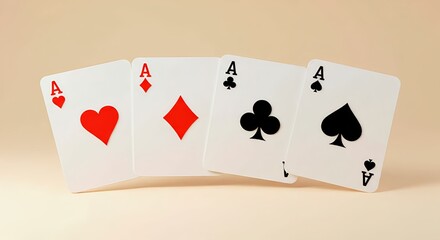 Obraz premium Four aces from a deck of playing cards on a light beige background