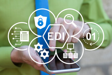 Business person using smartphone and virtual touch screen sees abbreviation: EDI. EDI or Electronic Data Interchange Information Technology Concept.
