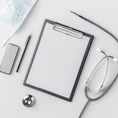 Medical Tools on White Desk with Stethoscope, Clipboard, and Pen