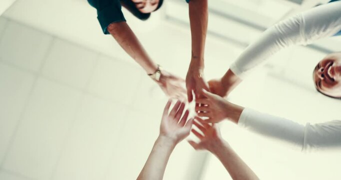 Hands, teamwork and unity in hospital, people and celebration of solidarity for healthcare or nurse. Below, medical professional and colleagues with support in clinic, stack and collaboration to help