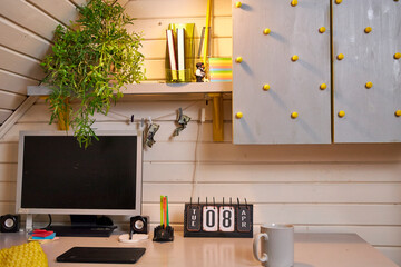 view of a creative workplace in a home office in yellow and gray tones
