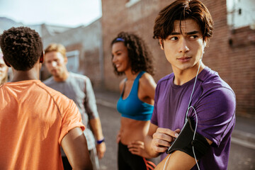 Group of young runners getting ready before workout outdoors