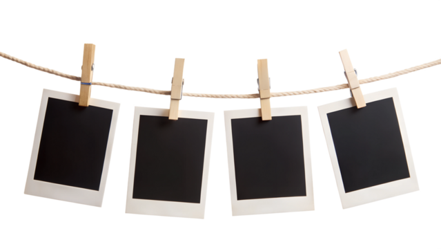 four blank instant photo frames hanging on a rope