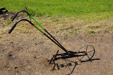 hand tool for the vegetable garden. hoe cycle to improve and prepare the fertile soil of the...