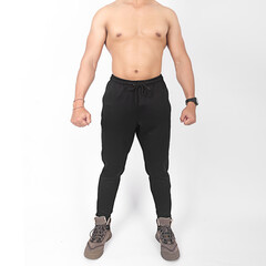 muscular Asian young man and fit body wearing scuba jogger pants