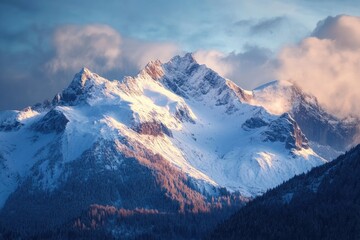 A scenic view of snow capped mountains with clouds in the sky during the day time in the winter season