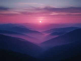 Fototapeta premium Pink and purple sunset over misty mountains.