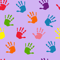 Fototapeta premium seamless pattern with colorful prints of children's hands on a purple background