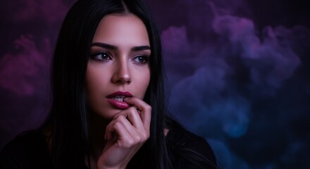 Intriguing beauty with intense gaze against a gradient smoke background