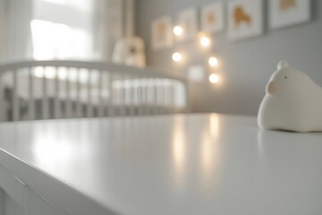 White table nursery dresser with crib in background