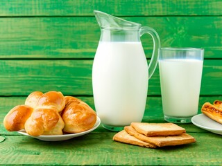 Breakfast tasty food concept - milk with bakery products blue wooden background. Consuming foods with low glycemic index such as milk-yoghurt-kefir along with carbohydrates to balance blood sugar.