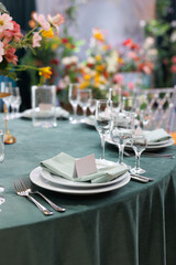Elegant table setting with a blank card for the name of the guest at the wedding banquet.