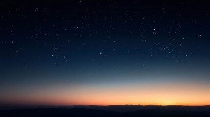 Obraz premium Starry night sky over a mountain range at sunset.