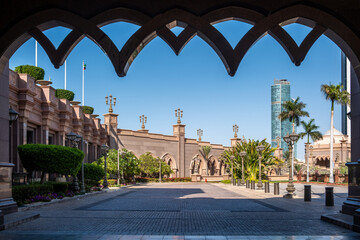 Arabesque architecture, arched windows and palm trees, Emirates Palace hotel in Abu Dhabi. UAE © Rawf8
